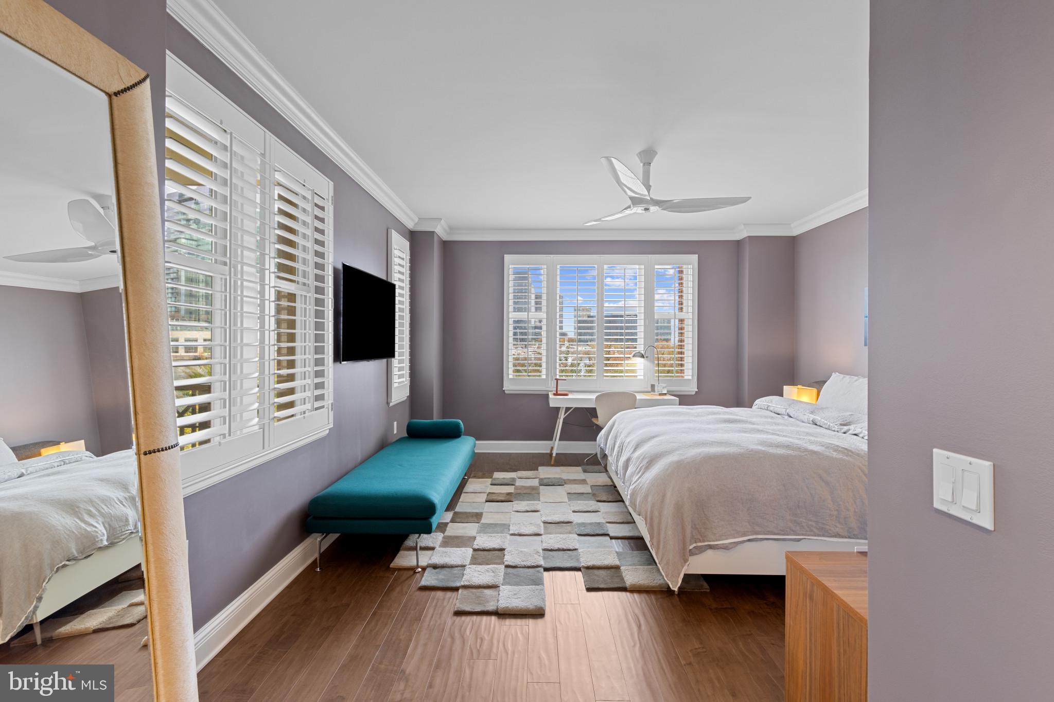 801 Key Highway, Unit 339 Baltimore, MD 21230 - Photo 21 of 44 a bedroom with a bed wooden floor and window