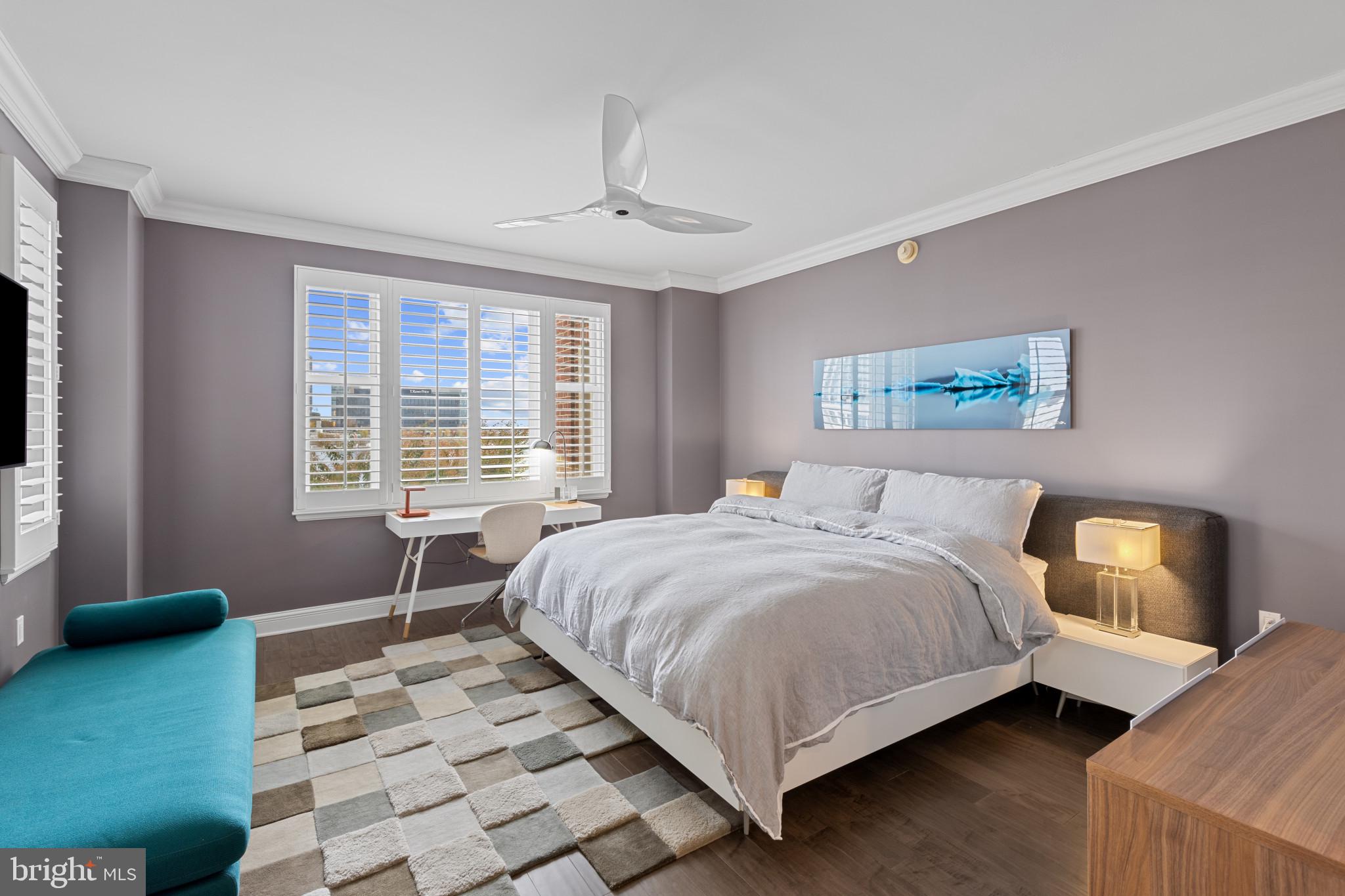 801 Key Highway, Unit 339 Baltimore, MD 21230 - Photo 22 of 44 a bedroom with a bed wooden floor and window