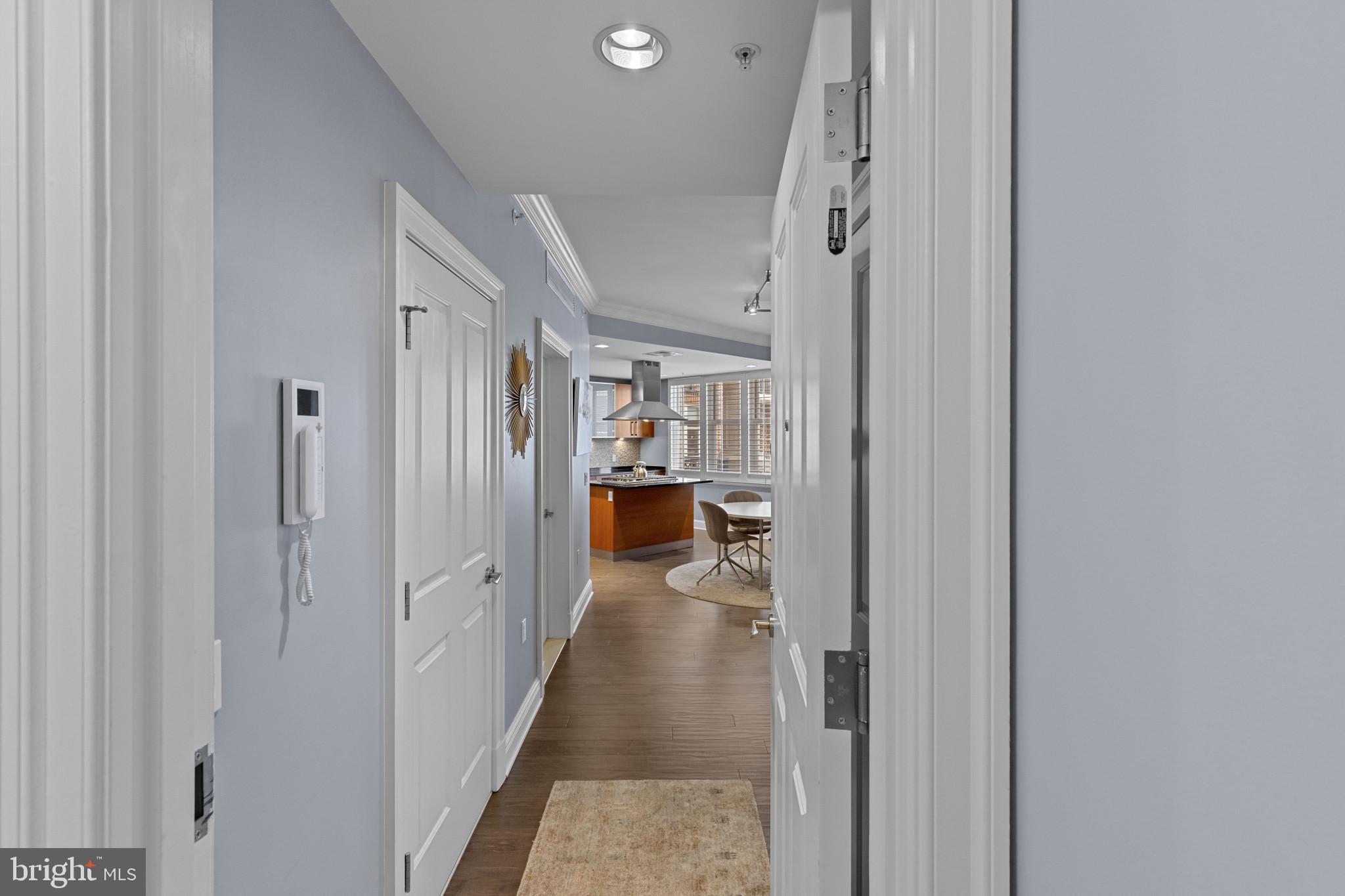 801 Key Highway, Unit 339 Baltimore, MD 21230 - Photo 3 of 44 a view of a hallway with wooden shelves