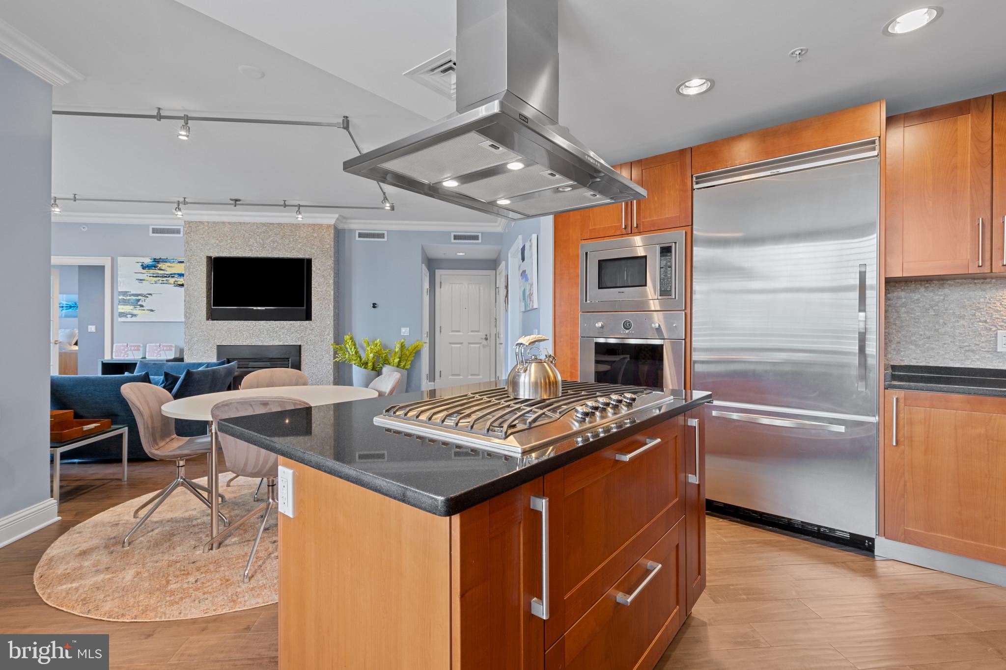 801 Key Highway, Unit 339 Baltimore, MD 21230 - Photo 6 of 44 a open kitchen with stainless steel appliances granite countertop a sink stove and refrigerator