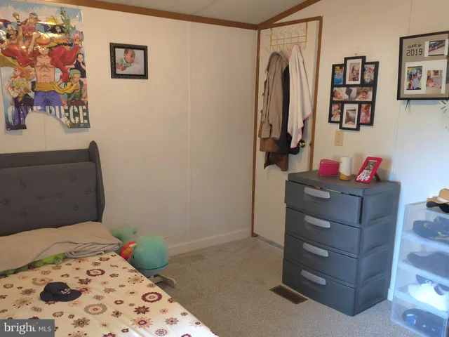 a bedroom with a bed and cabinets