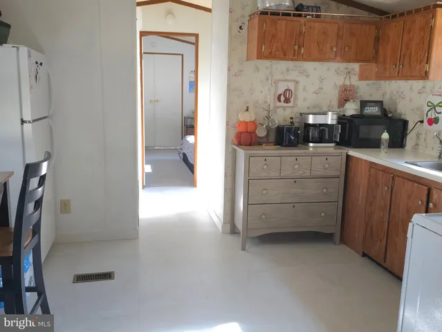 a kitchen with cabinets and a stove