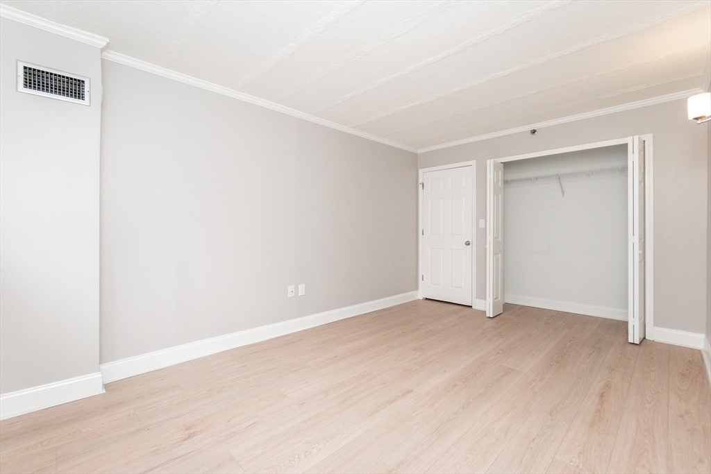 1933 Commonwealth Avenue, Unit 108 Boston, MA 02135 - Photo 17 of 27 a view of an empty room