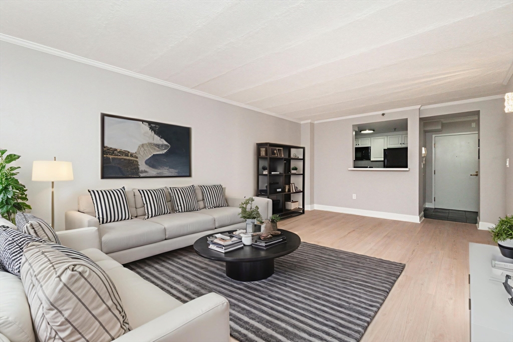 1933 Commonwealth Avenue, Unit 108 Boston, MA 02135 - Photo 2 of 27 a living room with furniture and wooden floor