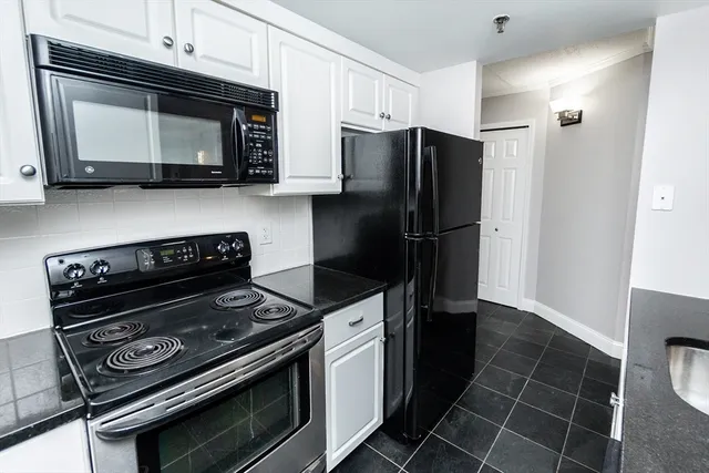 a kitchen with a stove and a microwave