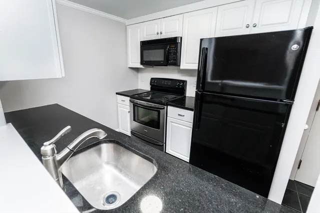 a kitchen with a stove and a microwave