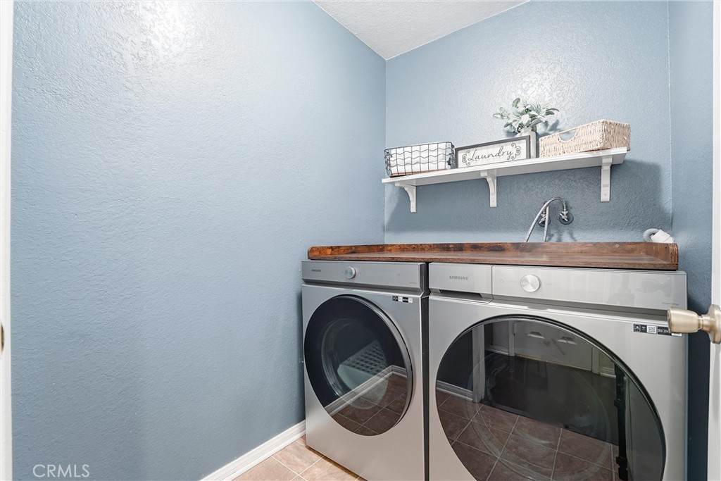 334 South Walnut Avenue, Unit D Brea, CA 92821 - Photo 16 of 32 a utility room with dryer and washer
