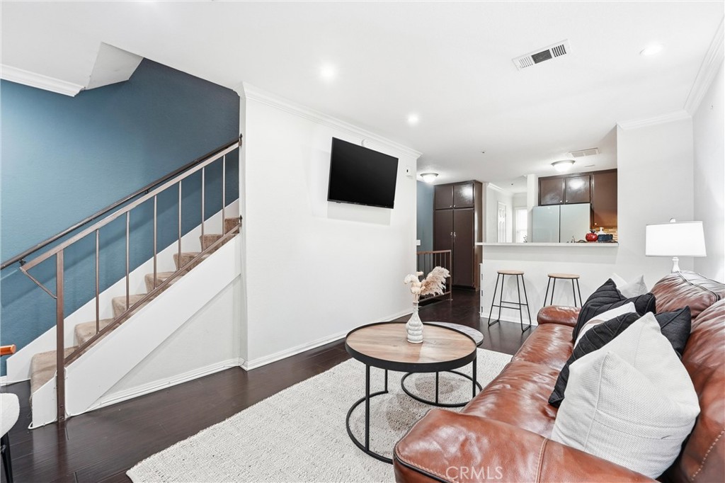 334 South Walnut Avenue, Unit D Brea, CA 92821 - Photo 4 of 32 a living room with furniture and a dining table