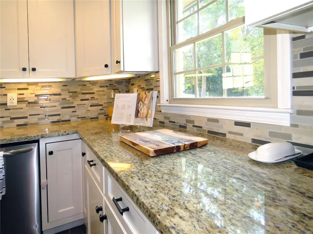 a view of living room with furniture and wooden floor