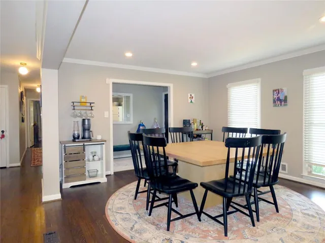 a view of a livingroom with furniture and hardwood floor