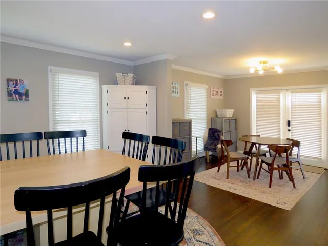 a bathroom with a granite countertop sink and a bathtub