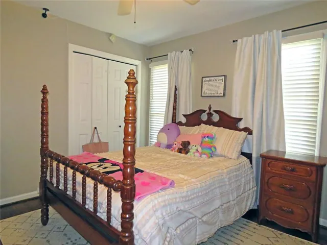 a living room with furniture a rug and a fireplace