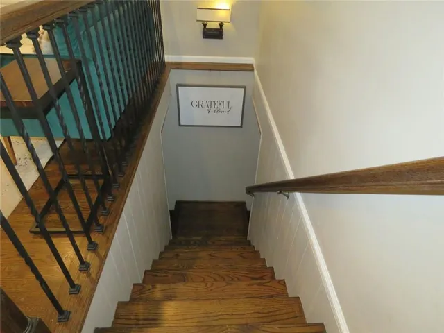 a view of a roof deck with wooden floor and fence