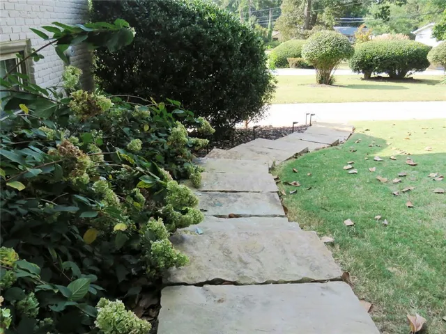 a stove top oven sitting inside of a kitchen