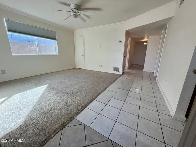 a view of an empty room and a window