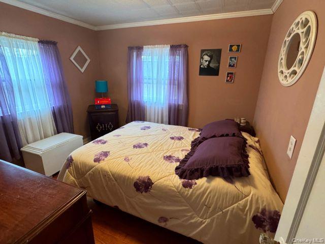 49 Ryan Road Jewett, NY 12444 - Photo 11 of 18 a bed sitting in a bedroom next to a window