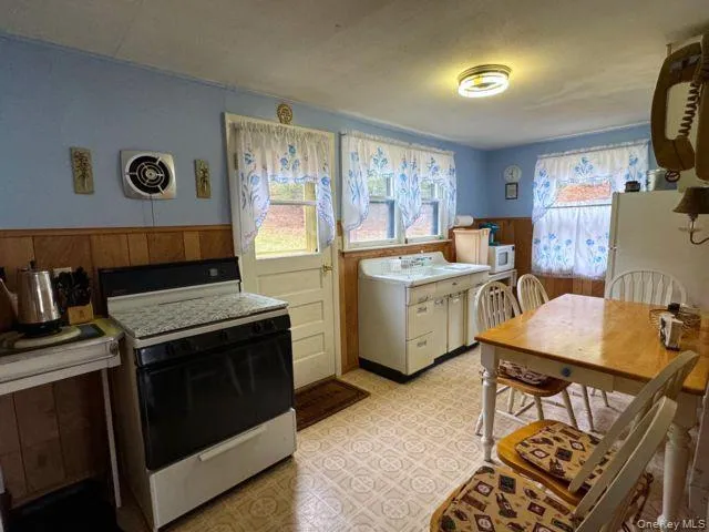 a kitchen that has a stove and a microwave