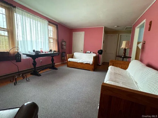 a living room with furniture and a window