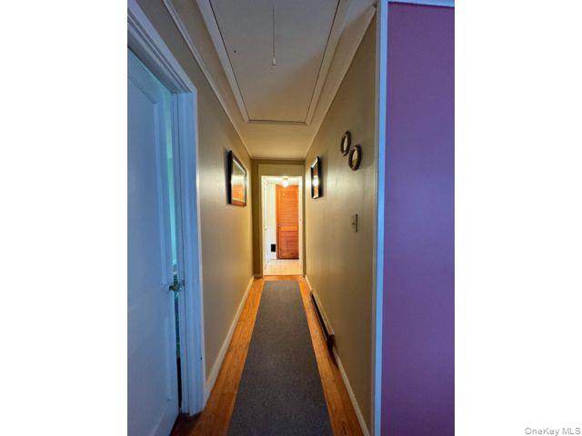 49 Ryan Road Jewett, NY 12444 - Photo 8 of 18 a view of a hallway with wooden floor