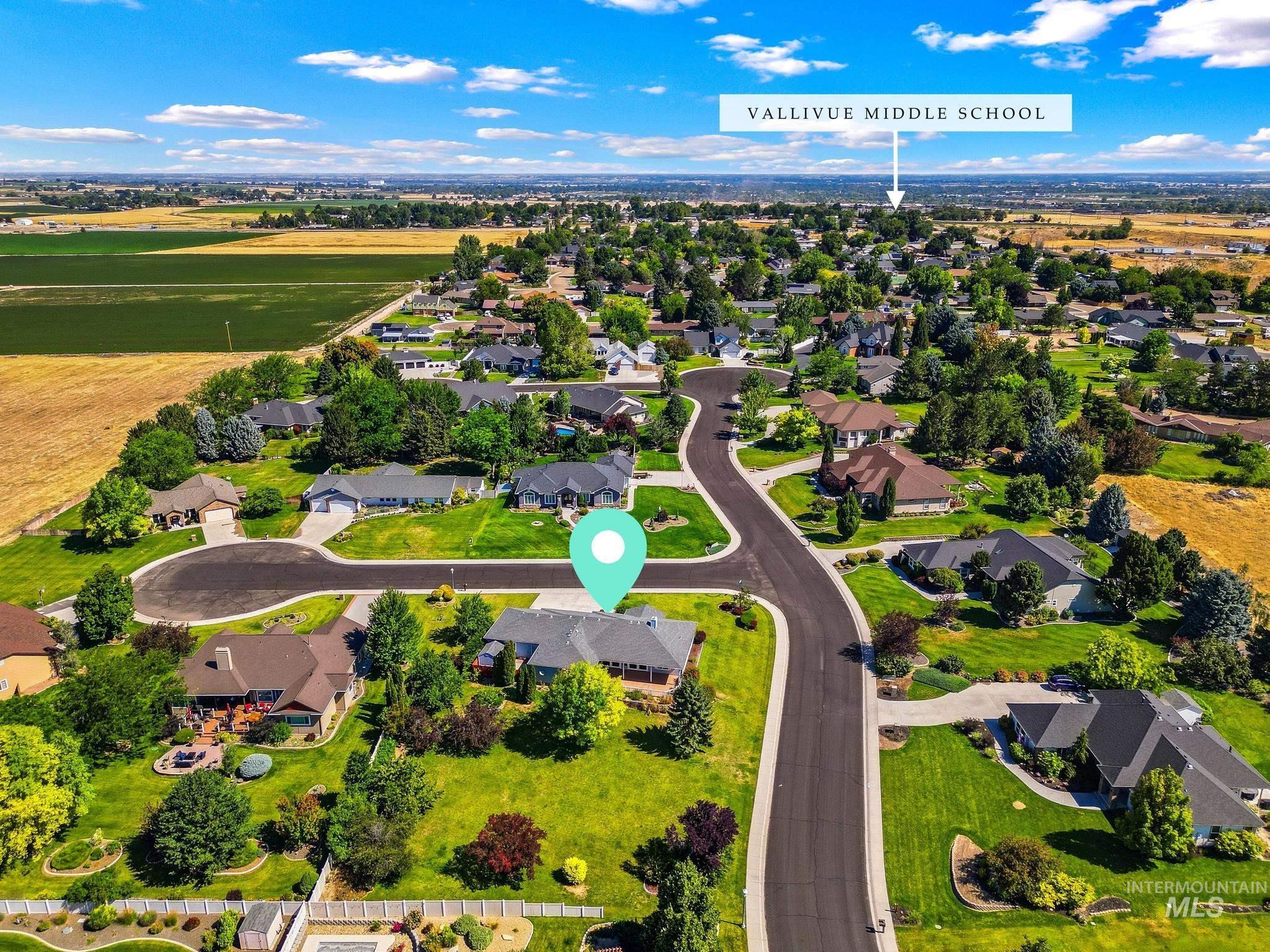 15181 Drury Way Caldwell, ID 83607 - Photo 45 of 49 Aerial perspective showcasing a residential neighborhood with landscaped yards and paved streets
