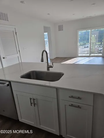 a kitchen with a sink and a window