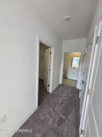 a view of livingroom with hardwood floor and hallway