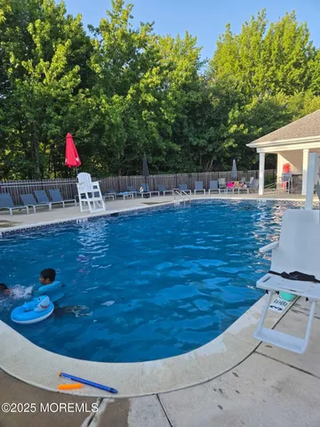 a view of a backyard with sitting area