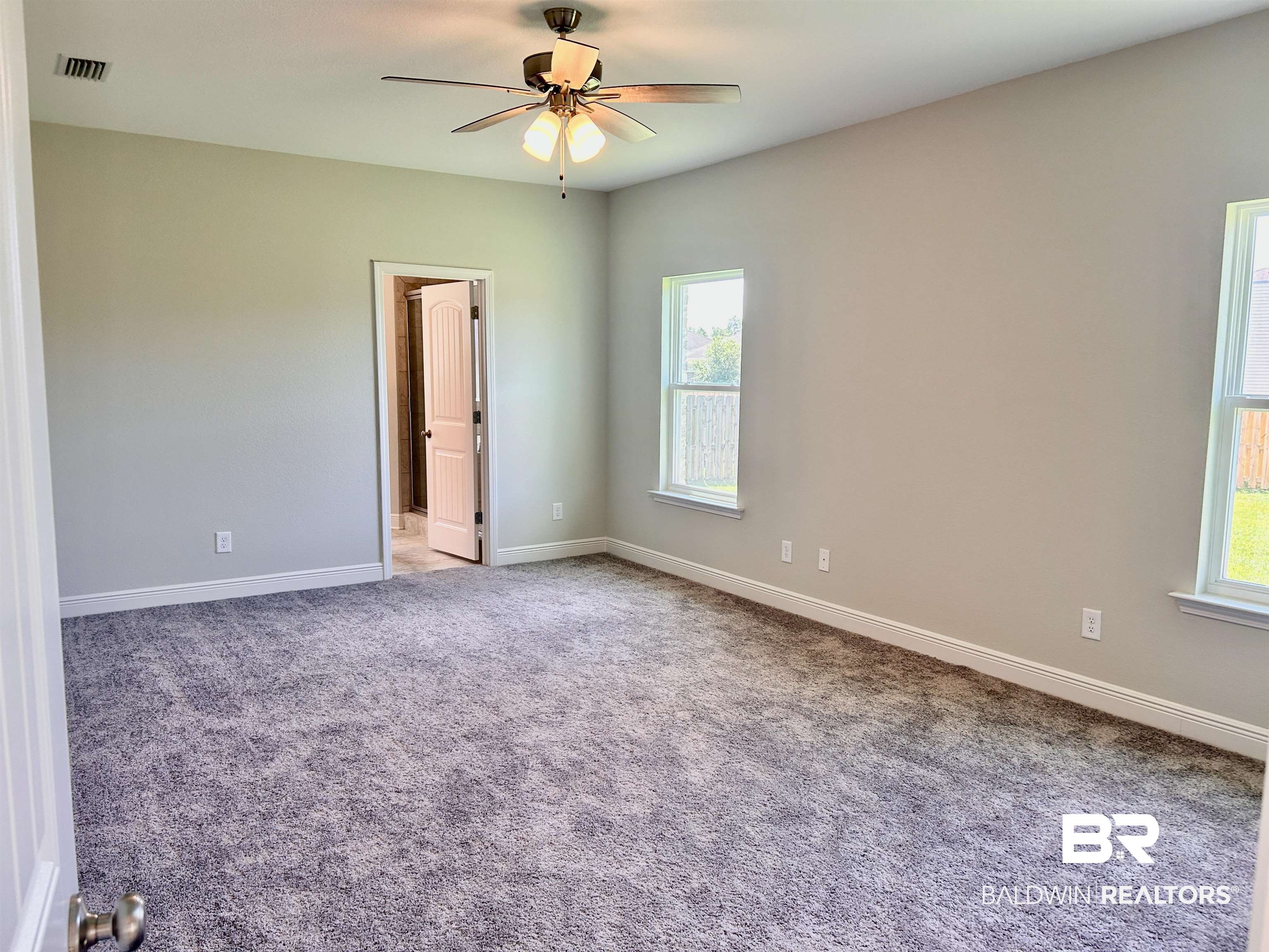 1267 Pembroke Way Foley, AL 36535 - Photo 13 of 17 Carpeted empty room with ceiling fan