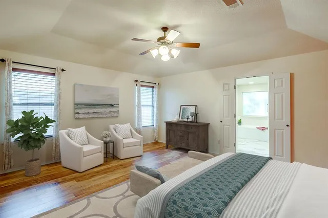 a bedroom with a balcony a bed and a couch