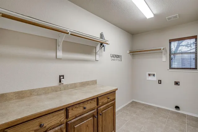 a view of a storage and utility room with closet