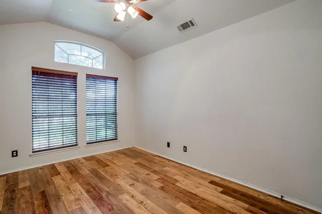 a view of empty room with windows