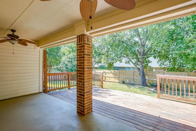 a view of livingroom with deck and floor to ceiling window and wooden floor