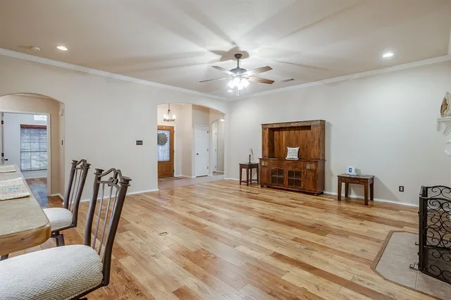 a view of a livingroom with furniture and a ceiling fan