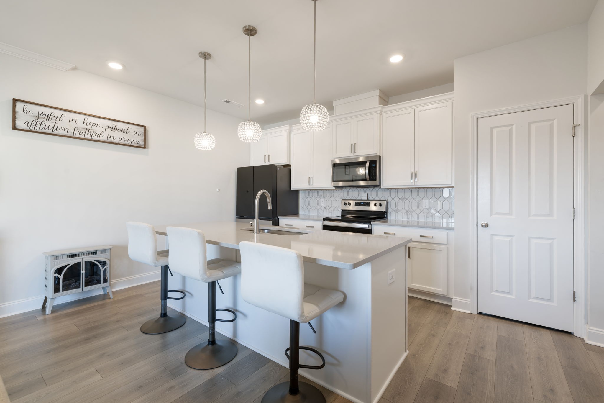 4018 Orsman Lane Antioch, TN 37013 - Photo 14 of 75 a kitchen with kitchen island white cabinets and stainless steel appliances