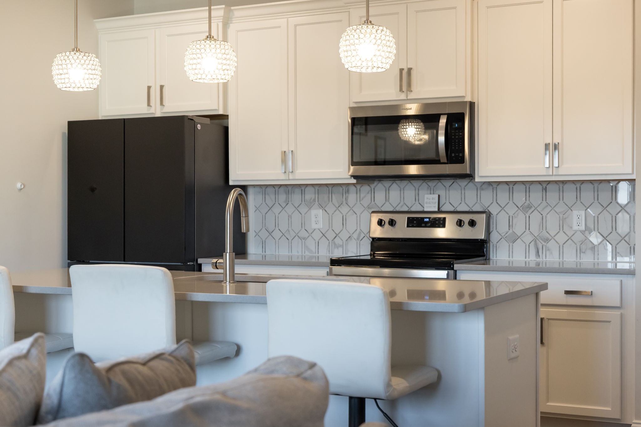 4018 Orsman Lane Antioch, TN 37013 - Photo 15 of 75 a kitchen with a sink and a stove top oven with wooden floor