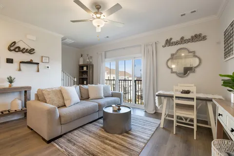 a spacious bedroom with a large bed and a chandelier