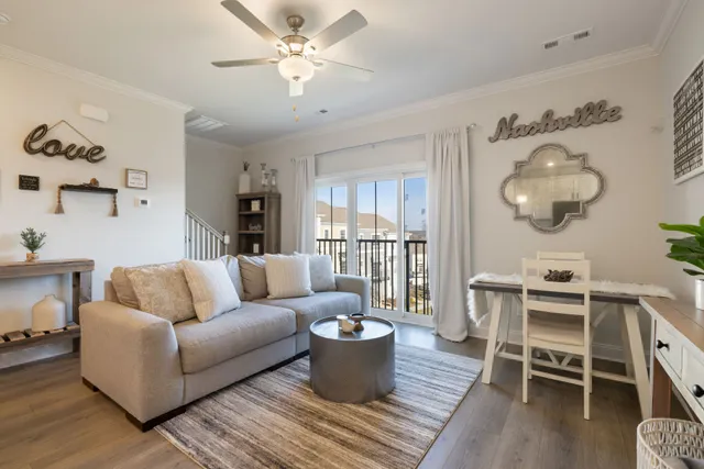 a spacious bedroom with a large bed and a chandelier