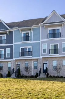 a house that has a large pool in front of it