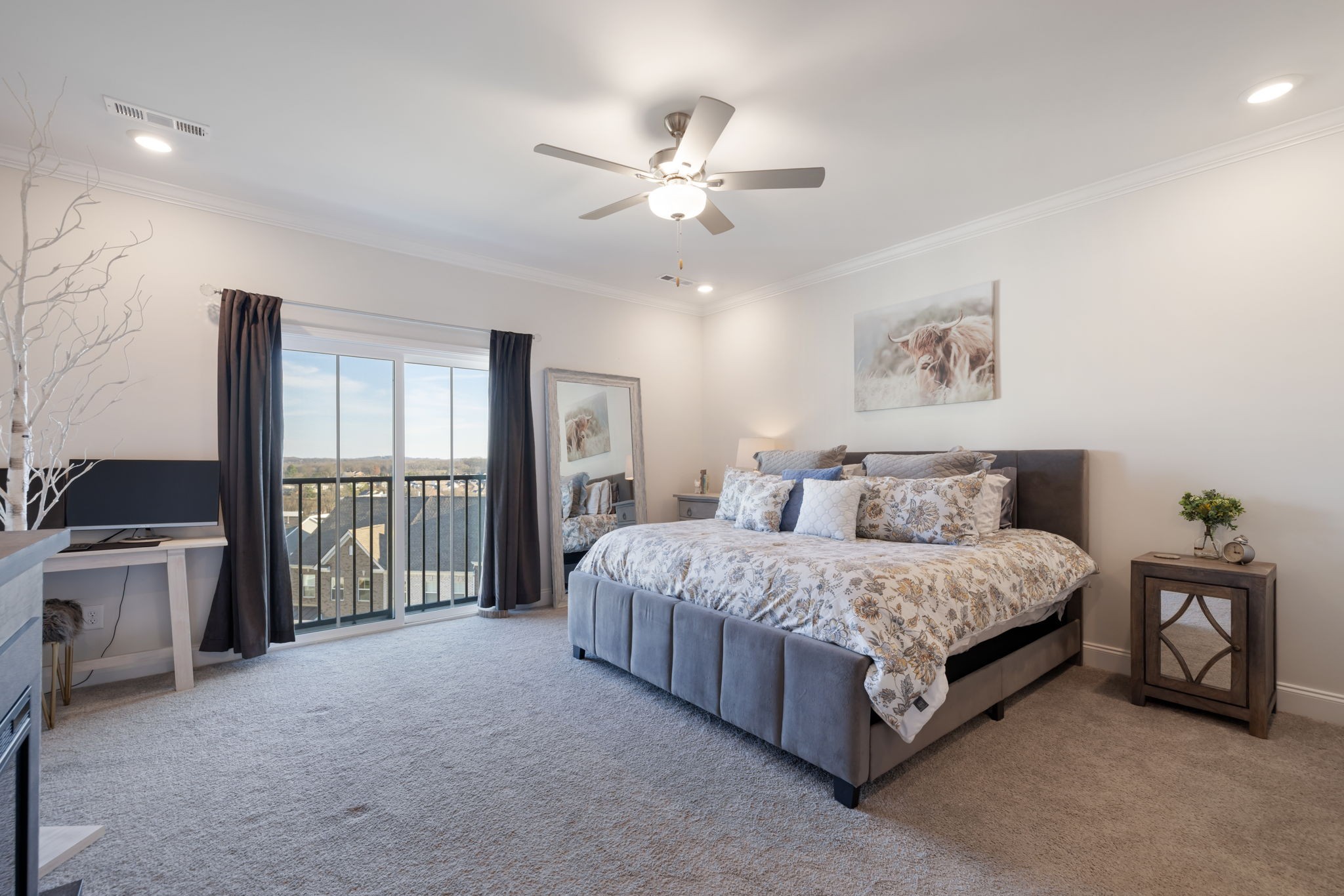 4018 Orsman Lane Antioch, TN 37013 - Photo 26 of 75 a spacious bedroom with a large bed and a chandelier