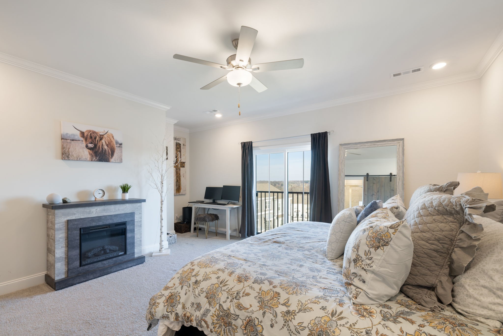 4018 Orsman Lane Antioch, TN 37013 - Photo 28 of 75 a spacious bedroom with a bed and a fireplace