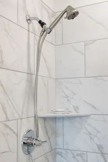 a living room with furniture and a stairs