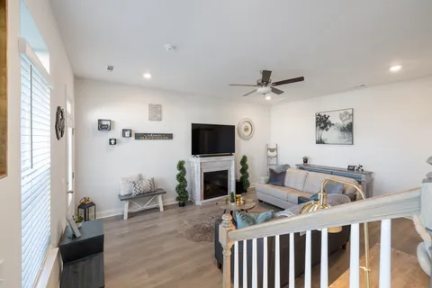 a front view of a house with swimming pool and porch