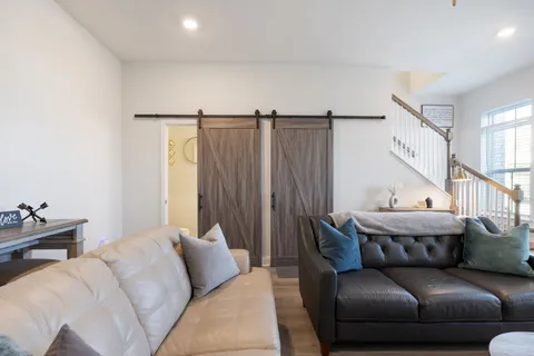 an aerial view of house with yard and mountain view in back