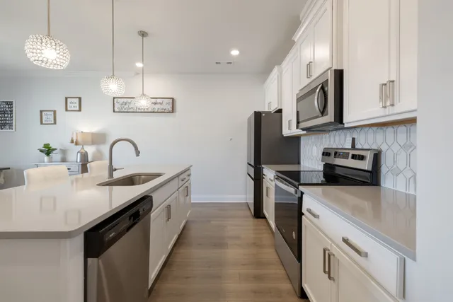 a kitchen with a stove and a microwave