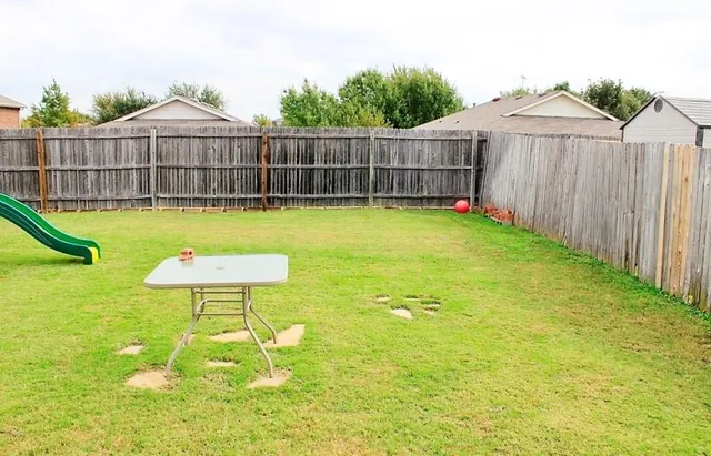 a swimming pool with wooden fence