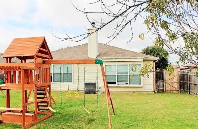 a view of a house with swimming pool
