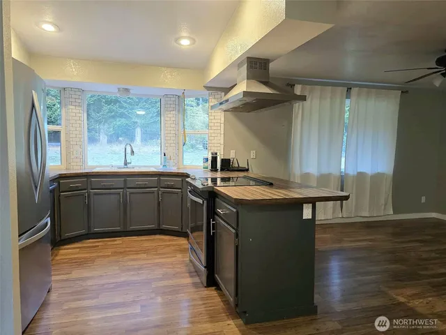 a kitchen with a sink and wooden cabinets