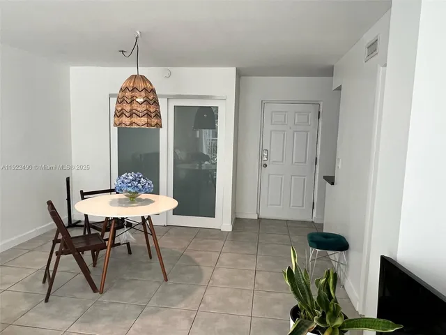 a kitchen with stainless steel appliances a stove microwave and refrigerator