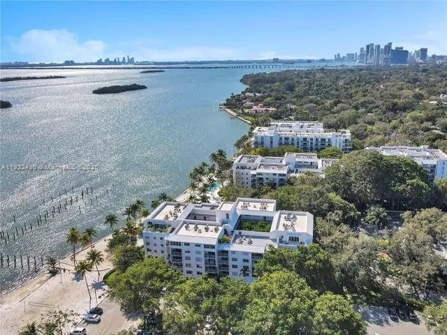a view of a swimming pool with a table and chairs