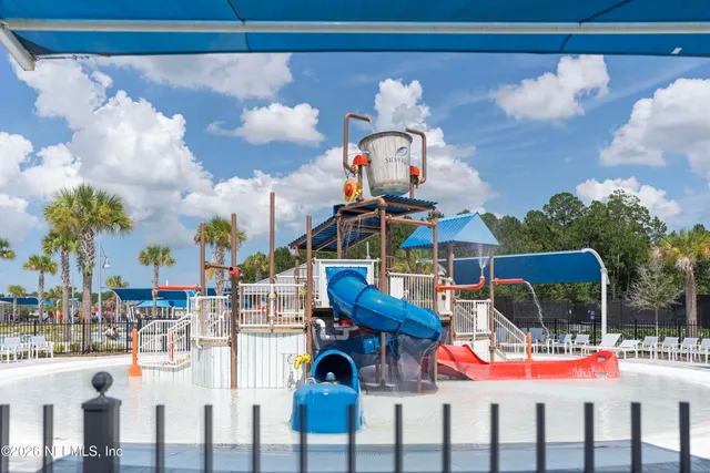 an aerial view of a pool table and chairs